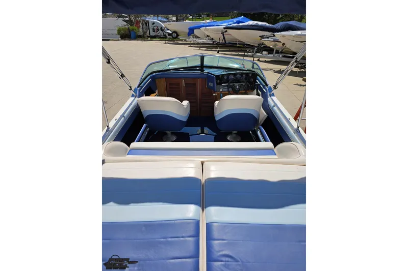 Slide: The Image of 1988 Glastron/Carlson CVX-23 boat interior with blue and white seating. - 36