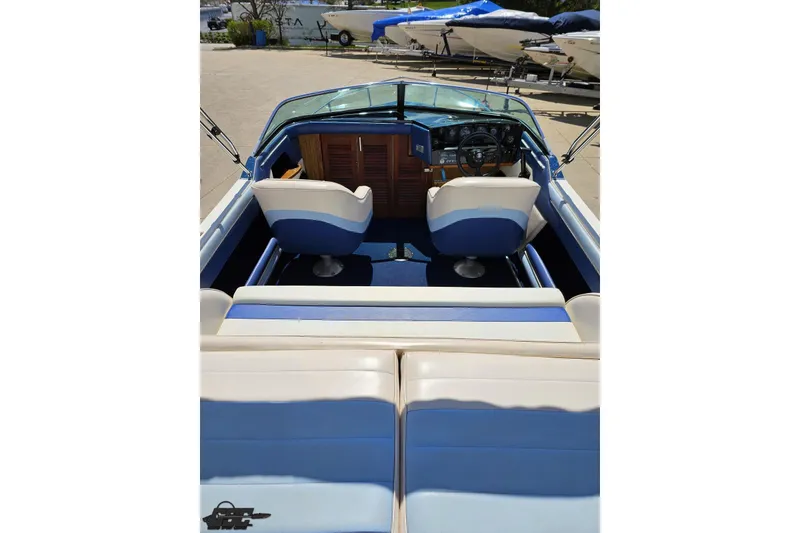 Slide: The Image of 1988 Glastron/Carlson CVX-23 boat interior with blue and white seating. - 37