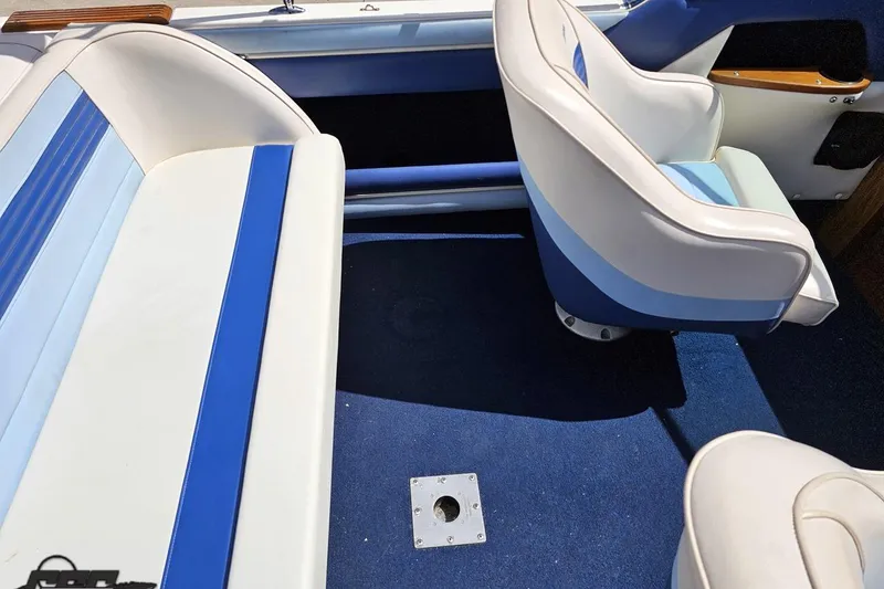 Slide: The Image of Interior of 1988 Glastron/Carlson CVX-23 boat with blue and white seating. - 42