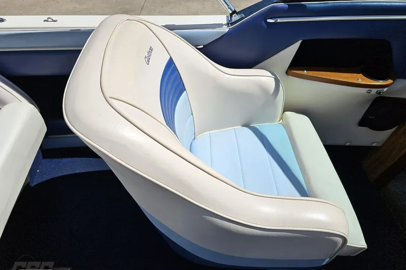 Slide: The Image of 1988 Glastron/Carlson CVX-23 boat interior with white and blue cushioned seat. - 44