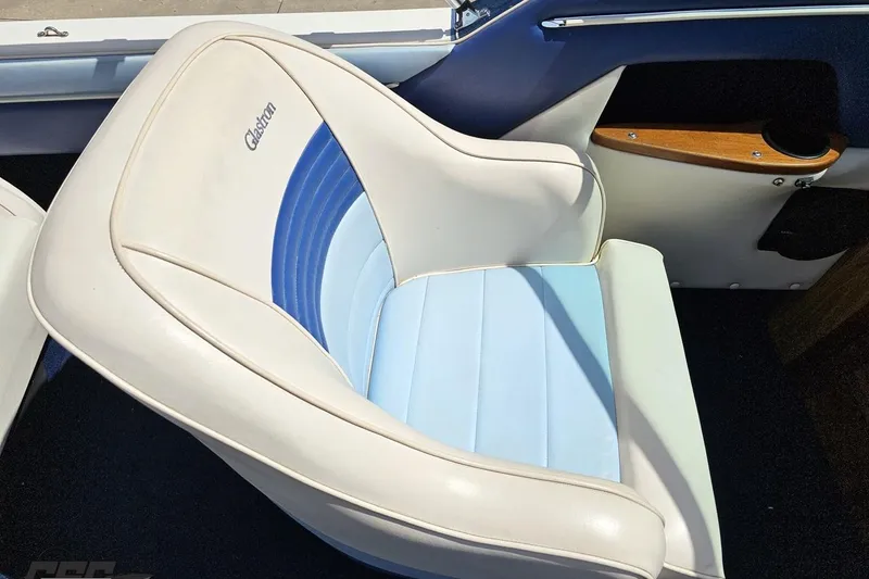 Slide: The Image of 1988 Glastron/Carlson CVX-23 boat seat with blue and white upholstery. - 45
