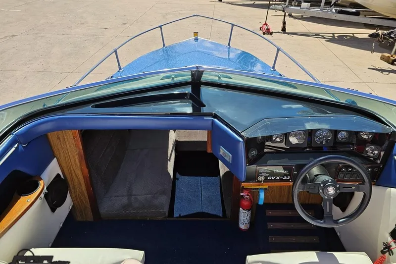 Slide: The Image of 1988 Glastron/Carlson CVX-23 boat interior with steering wheel and dashboard controls. - 51