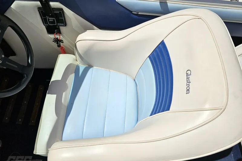 Slide: The Image of 1988 Glastron/Carlson CVX-23 boat interior with white and blue seating. - 53