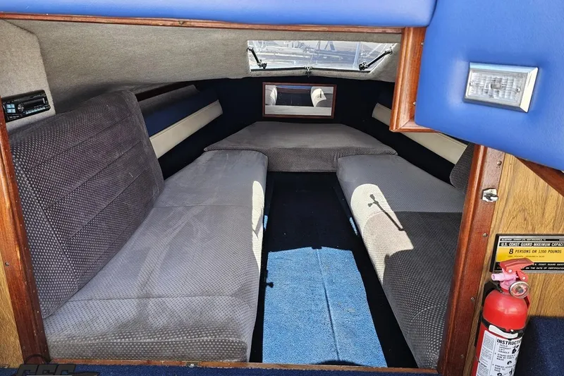 Slide: The Image of Interior of 1988 Glastron/Carlson CVX-23 boat with seating and fire extinguisher. - 62
