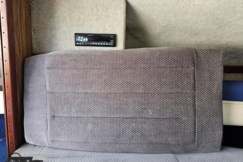 Slide: The Image of 1988 Glastron/Carlson CVX-23 interior with gray upholstery and stereo system. - 64