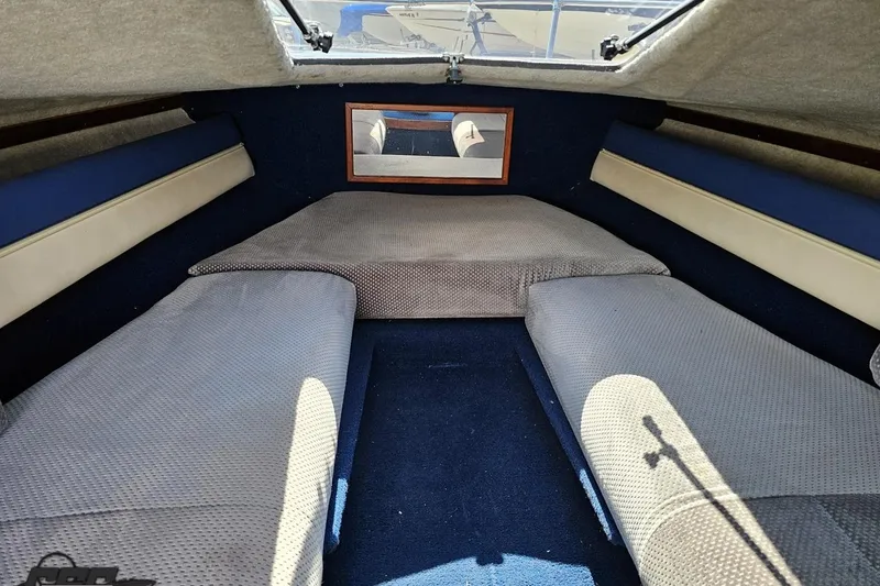 Slide: The Image of Interior cabin of 1988 Glastron/Carlson CVX-23 boat with cushioned seating. - 66