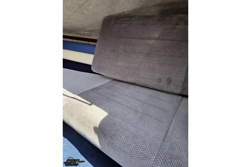 Slide: The Image of 1988 Glastron/Carlson CVX-23 interior seating with textured upholstery. - 69