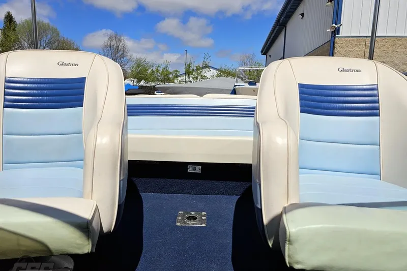 Slide: The Image of 1988 Glastron/Carlson CVX-23 boat interior with blue and white seating. - 70