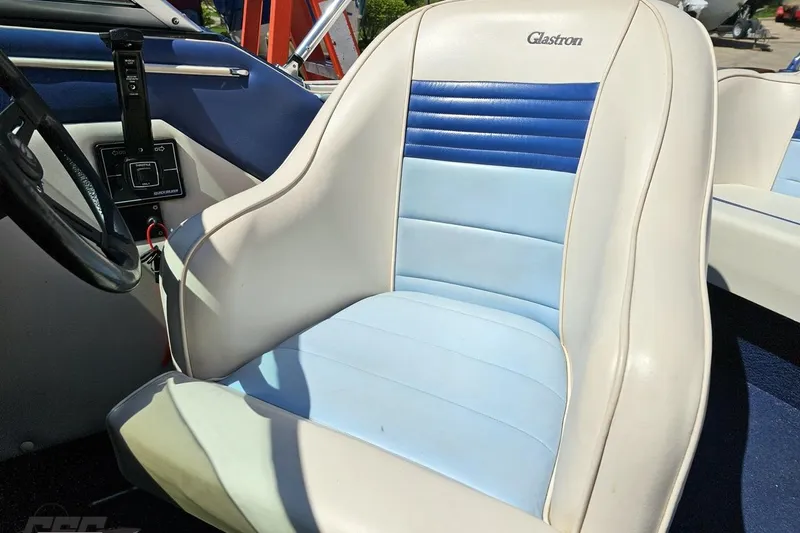Slide: The Image of 1988 Glastron/Carlson CVX-23 boat interior with blue and white seating. - 71