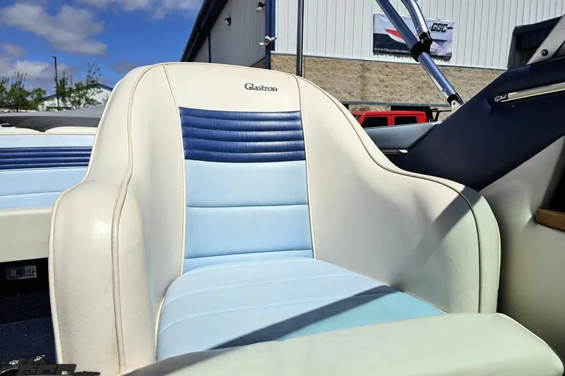 Slide: The Image of 1988 Glastron/Carlson CVX-23 boat seat with blue and white upholstery. - 72
