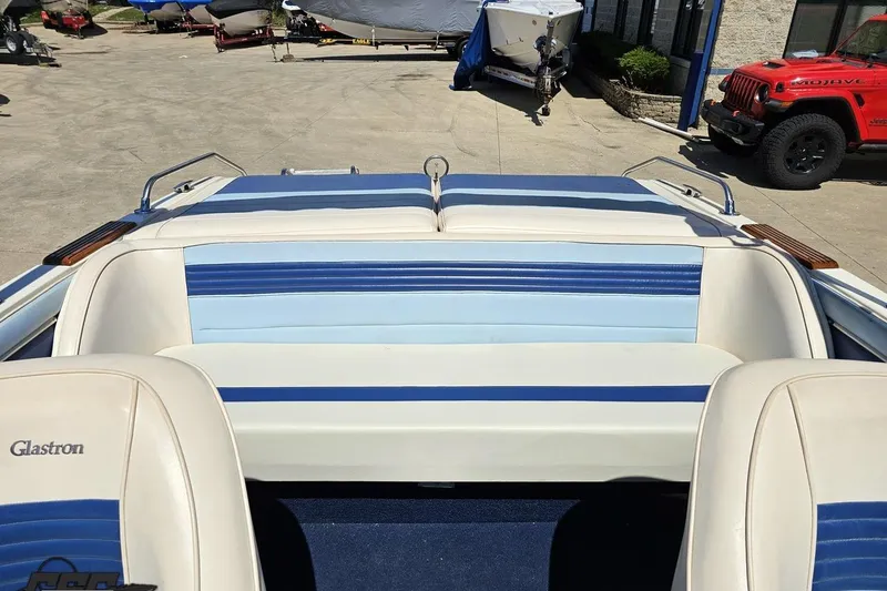 Slide: The Image of 1988 Glastron/Carlson CVX-23 boat interior with blue and white seating. - 73