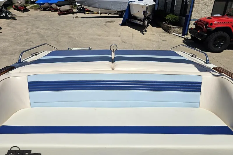 Slide: The Image of 1988 Glastron/Carlson CVX-23 boat interior with blue and white seating. - 74