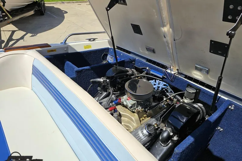 Slide: The Image of 1988 Glastron/Carlson CVX-23 boat engine compartment with open hatch. - 77