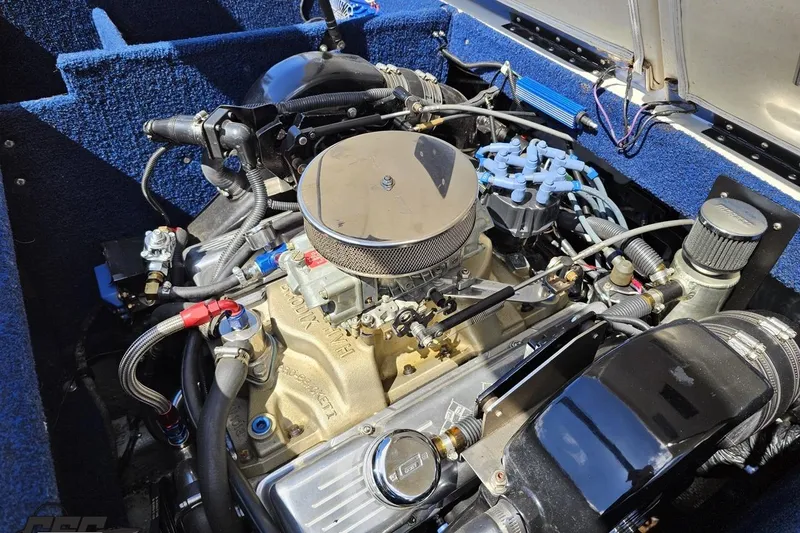 Slide: The Image of 1988 Glastron/Carlson CVX-23 engine compartment with detailed mechanical components. - 78