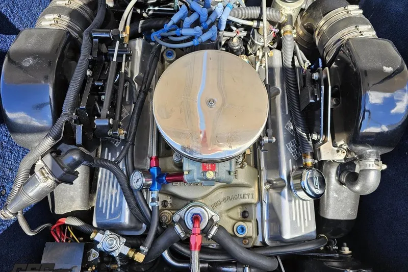 Slide: The Image of 1988 Glastron/Carlson CVX-23 engine with chrome air filter and detailed wiring. - 81