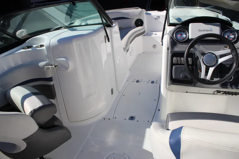 Slide: The Image of 2018 Hurricane SunDeck 2200 DC OB boat interior with steering wheel and seating. - 10