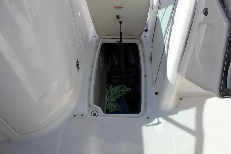 Slide: The Image of Storage compartment on 2018 Hurricane SunDeck 2200 DC OB boat with equipment inside. - 11