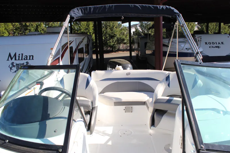 Slide: The Image of 2018 Hurricane SunDeck 2200 DC OB boat with seating, under covered storage. - 12