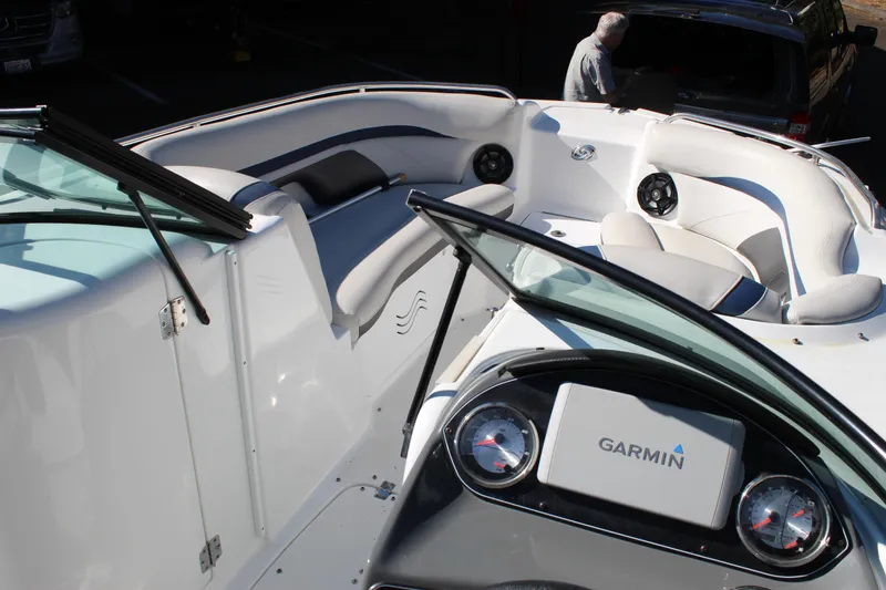 Slide: The Image of 2018 Hurricane SunDeck 2200 DC OB boat interior with Garmin dashboard and seating. - 5
