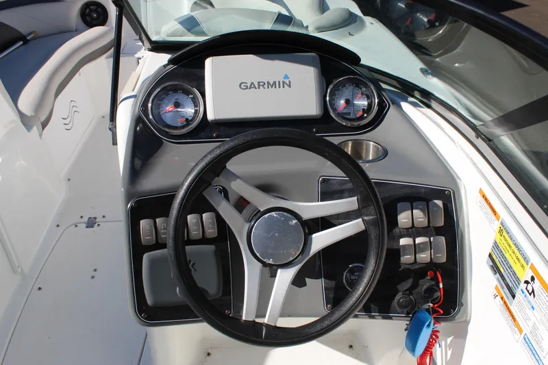 Slide: The Image of 2018 Hurricane SunDeck 2200 DC OB boat dashboard with Garmin navigation system and controls. - 6
