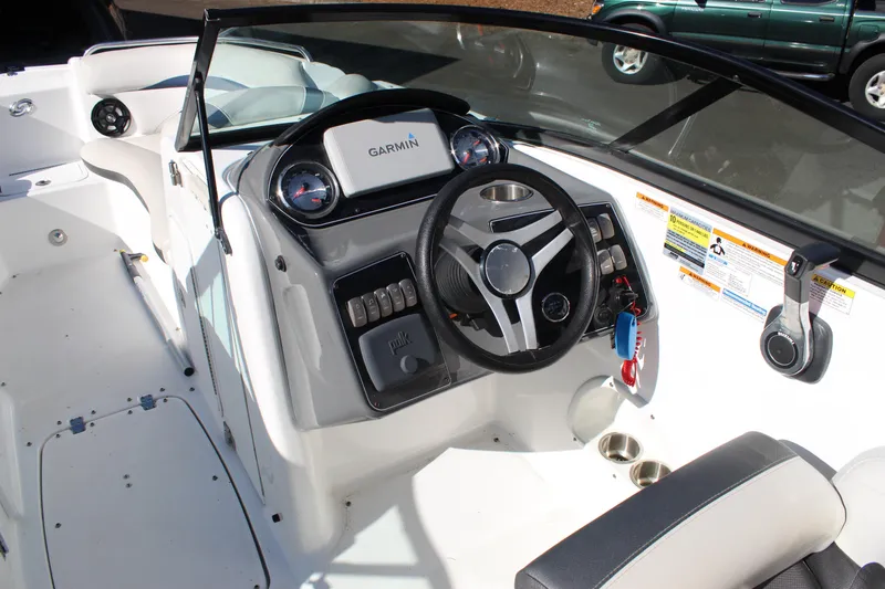 Slide: The Image of 2018 Hurricane SunDeck 2200 DC OB boat cockpit with Garmin navigation system and steering wheel. - 8