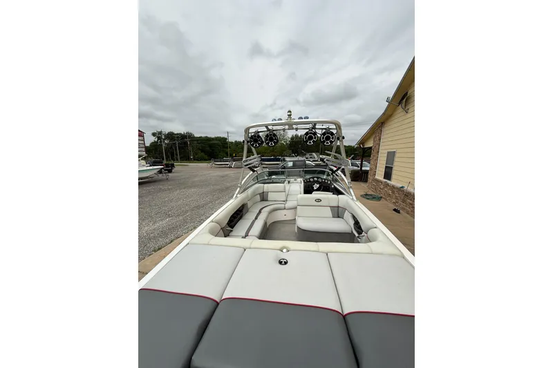 Slide: The Image of 2005 Supra Sunsport 24 V boat with spacious seating and sleek design. - 9
