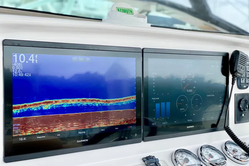 Slide: The Image of Dashboard of a 2006 Donzi 38 ZSF with Garmin navigation displays and controls. - 11