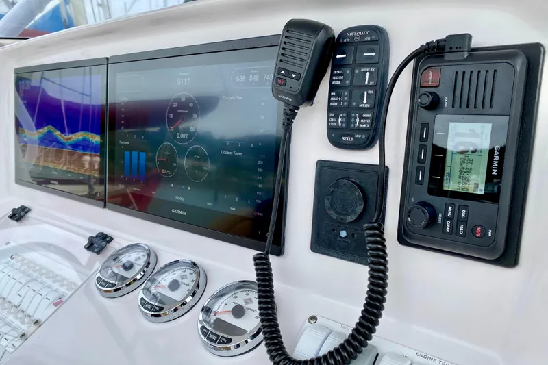Slide: The Image of Dashboard of a 2006 Donzi 38 ZSF boat with Garmin navigation equipment. - 12