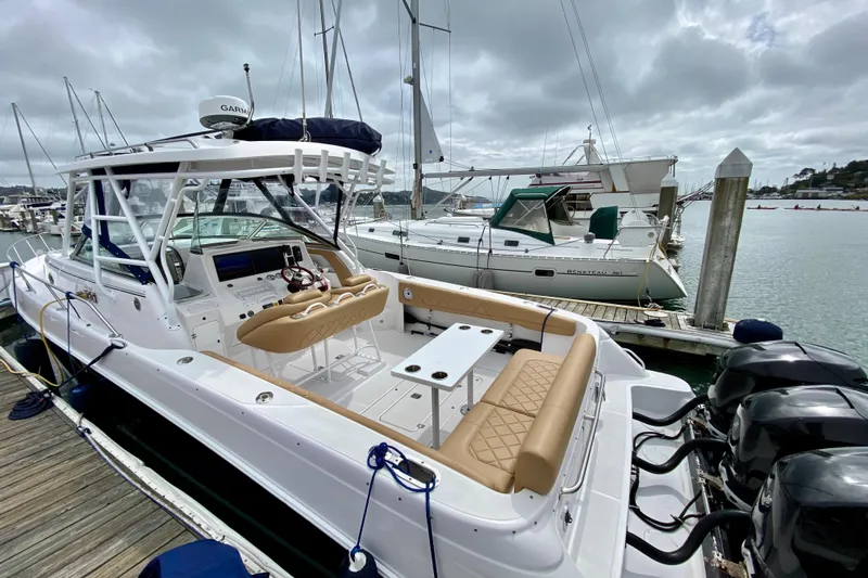 Slide: The Image of 2006 Donzi 38 ZSF boat docked at marina with overcast sky. - 19