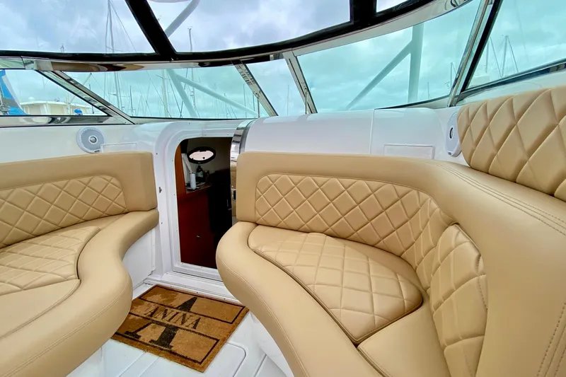 Slide: The Image of Luxurious interior of a 2006 Donzi 38 ZSF boat with tan quilted seating. - 2