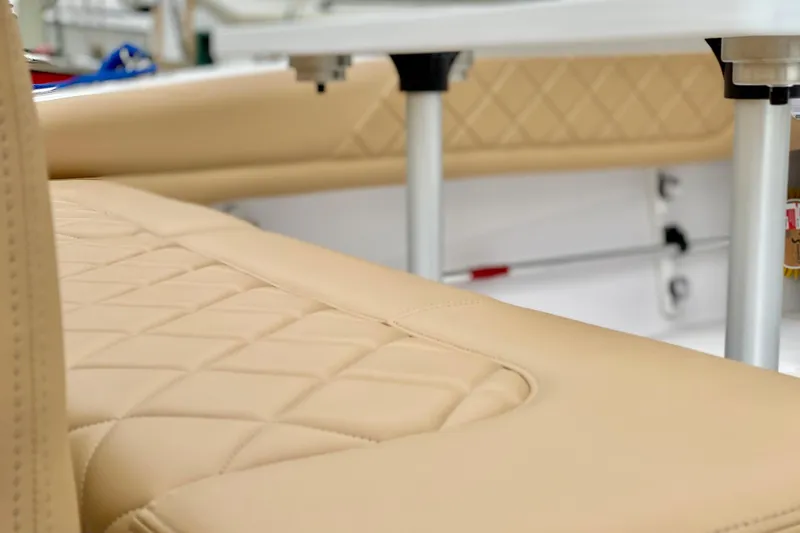 Slide: The Image of Luxurious beige seating on a 2006 Donzi 38 ZSF boat, showcasing diamond stitching. - 23