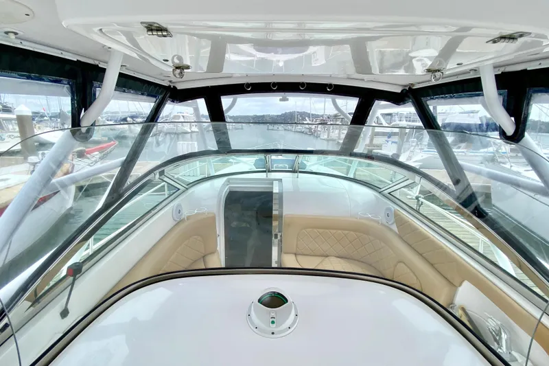 Slide: The Image of Interior view of 2006 Donzi 38 ZSF boat with tan seating and clear windshield. - 44
