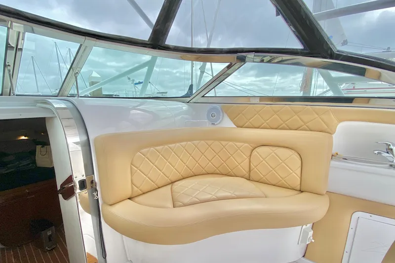Slide: The Image of Luxurious interior of a 2006 Donzi 38 ZSF boat with beige quilted seating. - 45