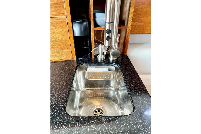 Slide: The Image of Stainless steel sink in 2006 Donzi 38 ZSF boat kitchen with modern faucet. - 48