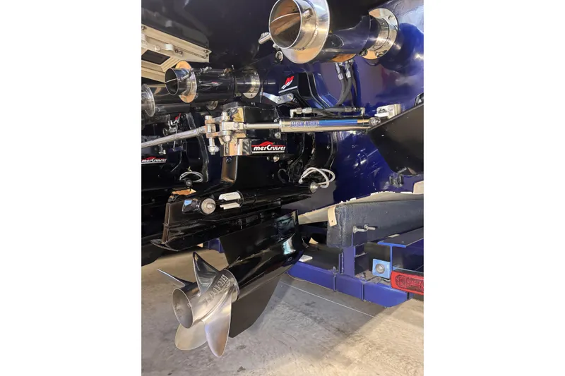 Slide: The Image of Close-up of a 2000 Python Offshore boat's engine and propeller system. - 14