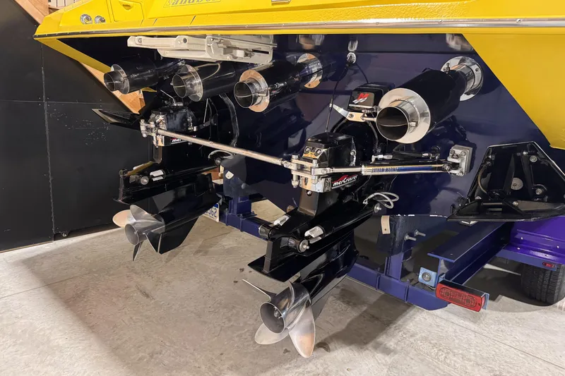 Slide: The Image of Rear view of a 2000 Python Offshore boat with dual propellers and exhaust system. - 15