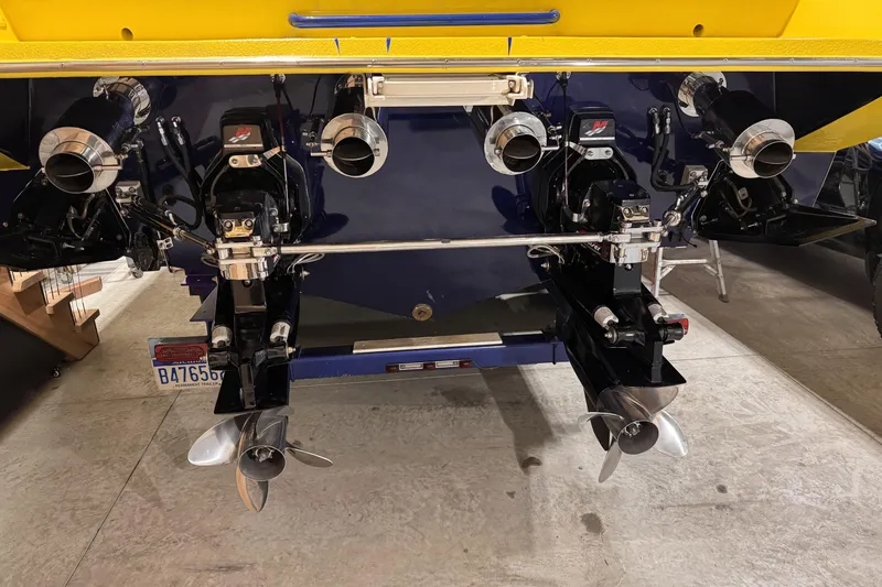 Slide: The Image of Rear view of a 2000 Python Offshore boat with dual propellers and exhaust system. - 16