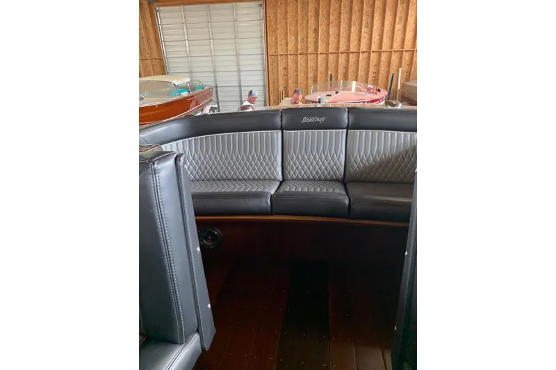 Slide: The Image of Luxurious interior of a 2011 StanCraft 30 Twin Arrow boat with leather seating. - 5