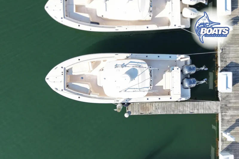 Slide: The Image of Overhead view of 2021 Grady-White Canyon 306 boat docked with twin engines. - 21