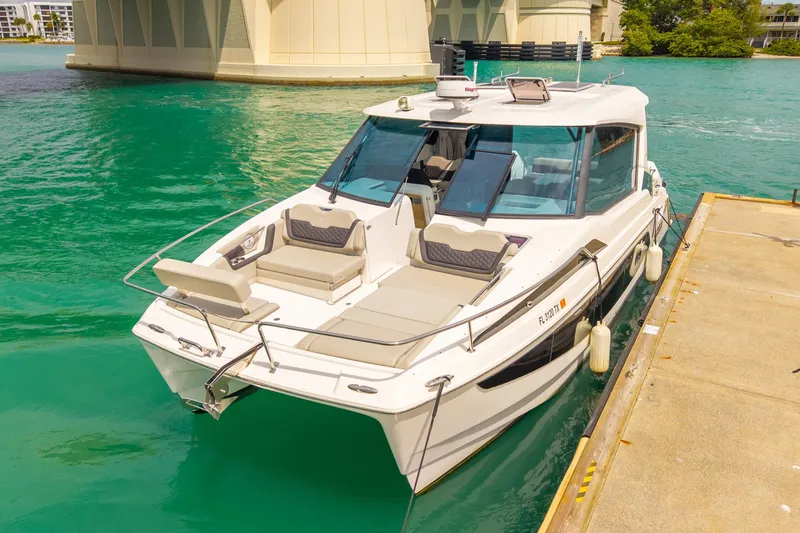 The Image of Aquila 36 Cruiser 2025 docked on turquoise water near a bridge. - 0