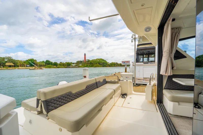 Slide: The Image of Aquila 36 Cruiser 2025 yacht interior with scenic waterfront view. - 12