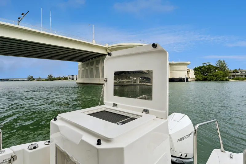 Slide: The Image of Aquila 36 Cruiser 2025 on water near a bridge, featuring Mercury outboard engines. - 16