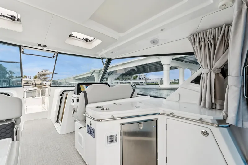 Slide: The Image of Interior view of 2025 Aquila 36 Cruiser yacht with modern design and bridge view. - 21