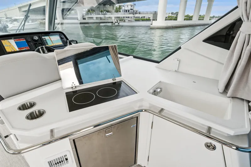 Slide: The Image of Modern kitchen area on 2025 Aquila 36 Cruiser yacht with stove and sink. - 23