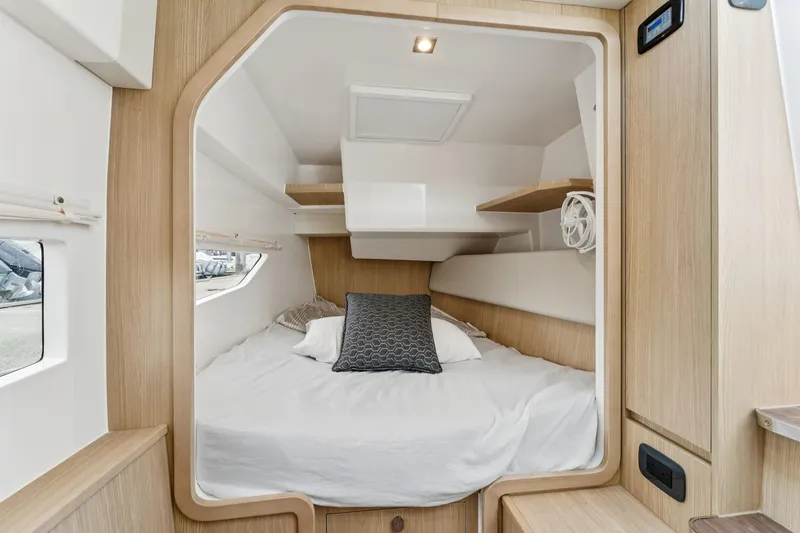 Slide: The Image of Cozy cabin interior of 2025 Aquila 36 Cruiser with modern wood finish and comfortable bedding. - 34