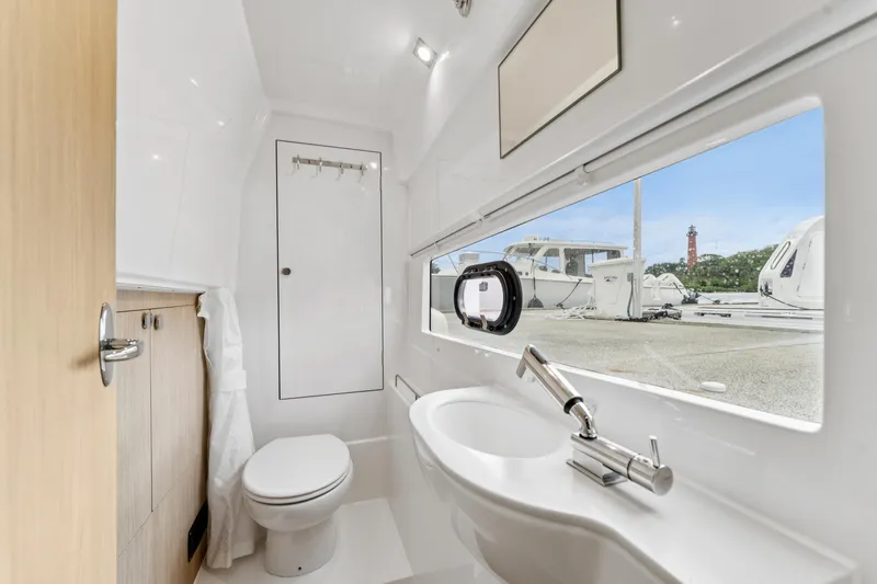Slide: The Image of Modern bathroom interior of 2025 Aquila 36 Cruiser yacht with sleek fixtures and large window. - 37