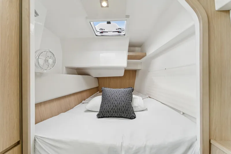 Slide: The Image of Cozy cabin interior of 2025 Aquila 36 Cruiser with modern bedding and natural light. - 38