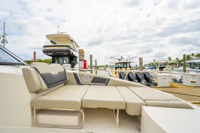 Slide: The Image of Aquila 36 Cruiser 2025 at marina, featuring luxurious seating and modern design. - 47
