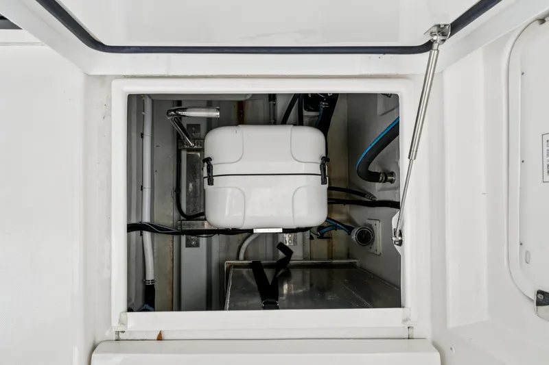 Slide: The Image of Aquila 36 Cruiser 2025 engine compartment with visible components and wiring. - 58
