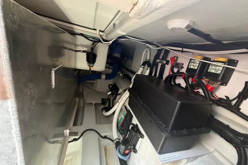 Slide: The Image of Engine compartment of 2025 Aquila 36 Cruiser, showcasing wiring and mechanical components. - 59